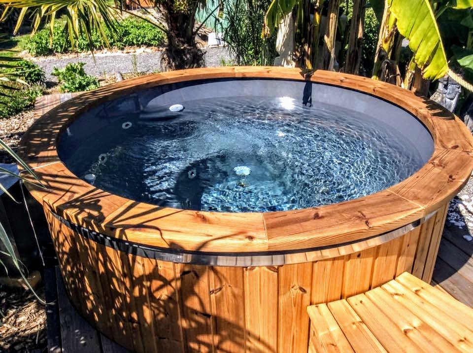 Wooden hot tub full of water